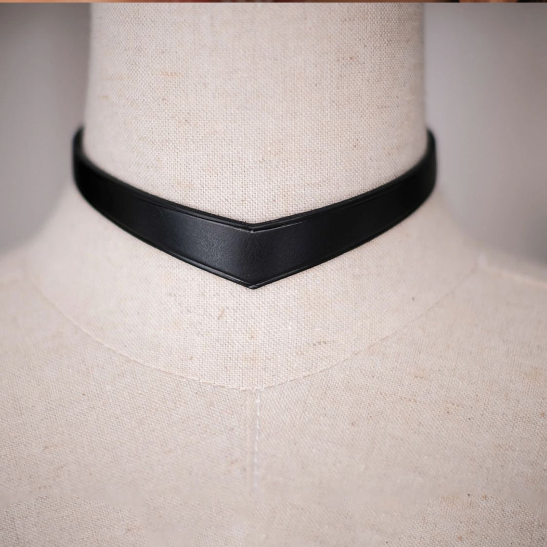Black choker on a mannequin with 'hushcrafts' branding.