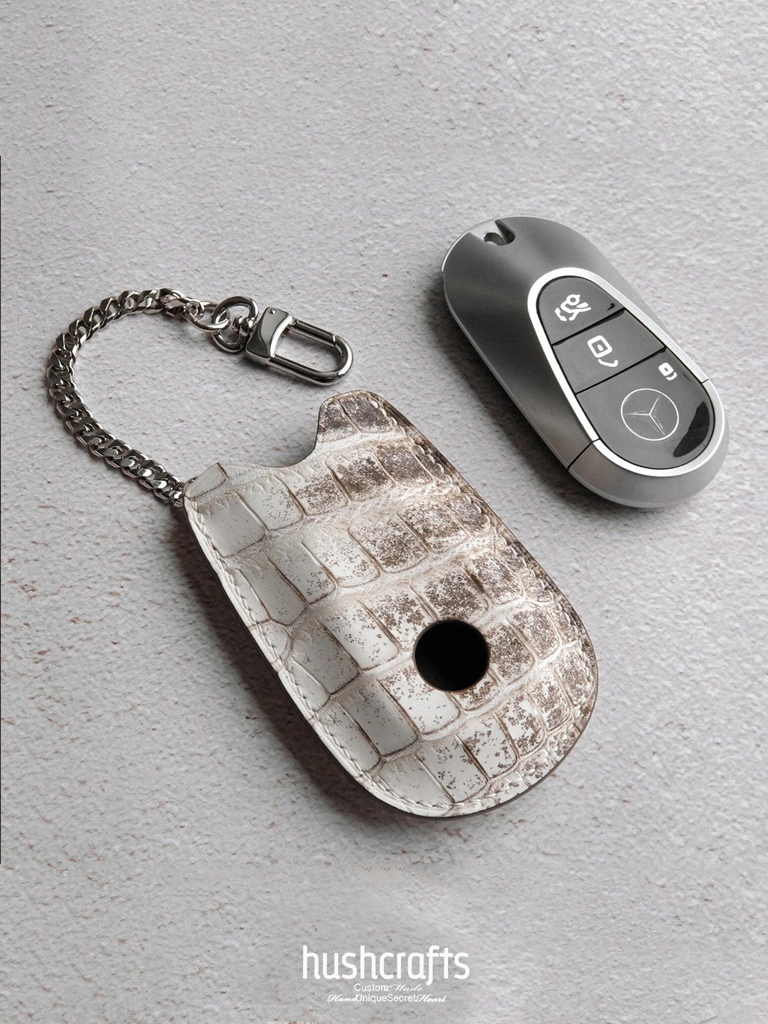 Car Key Leather Case on a gray surface with 'hushcrafts' branding.