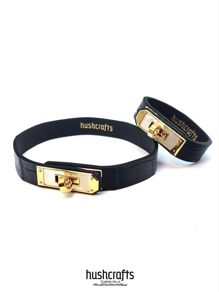 Black and gold collars with 'hushcrafts' branding on a white background