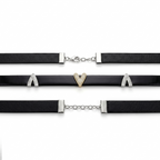 Black chokers with heart-shaped pendants on a white background
