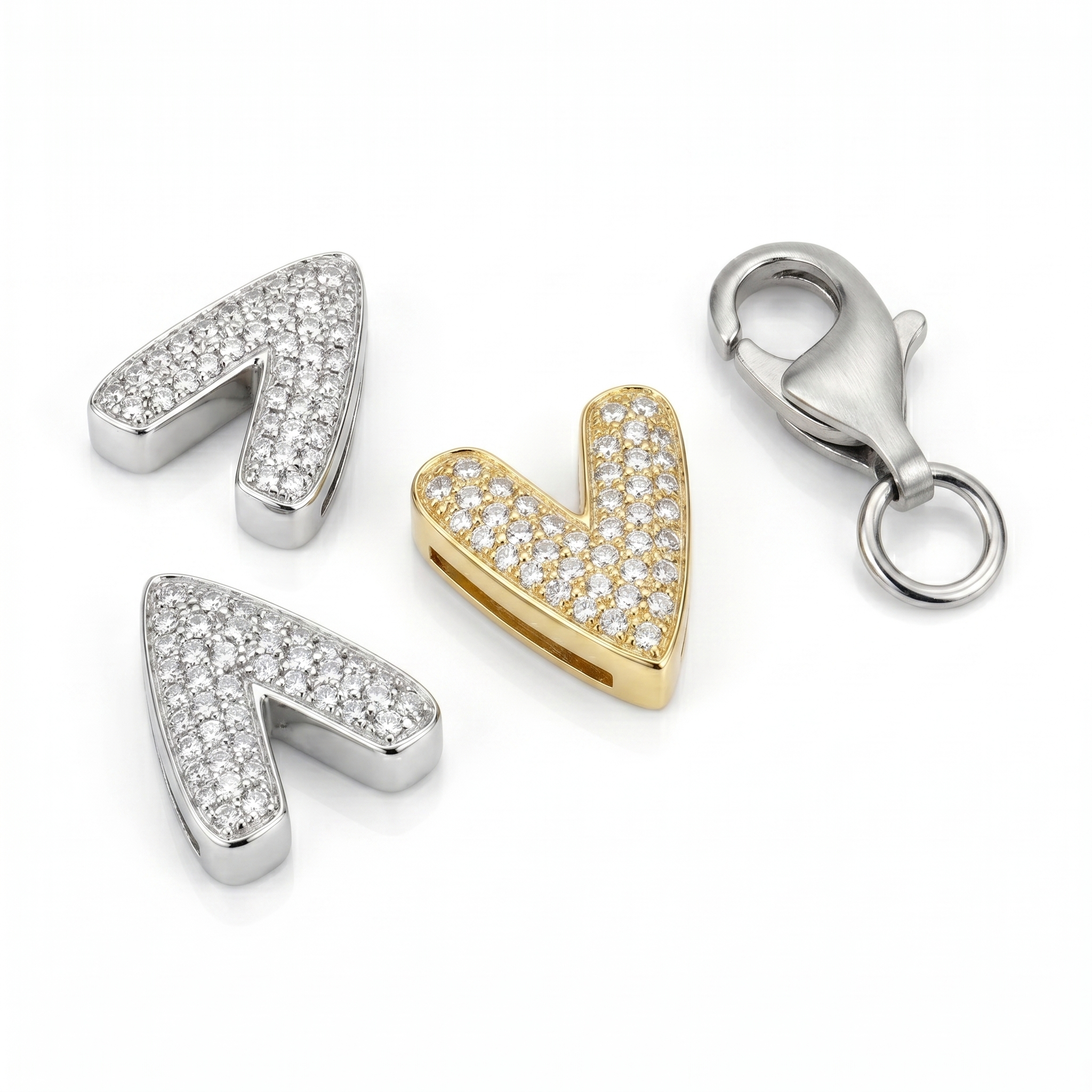 Three silver pendants shaped like arrows and a heart, with a gold heart pendant and a silver clasp on a white background.