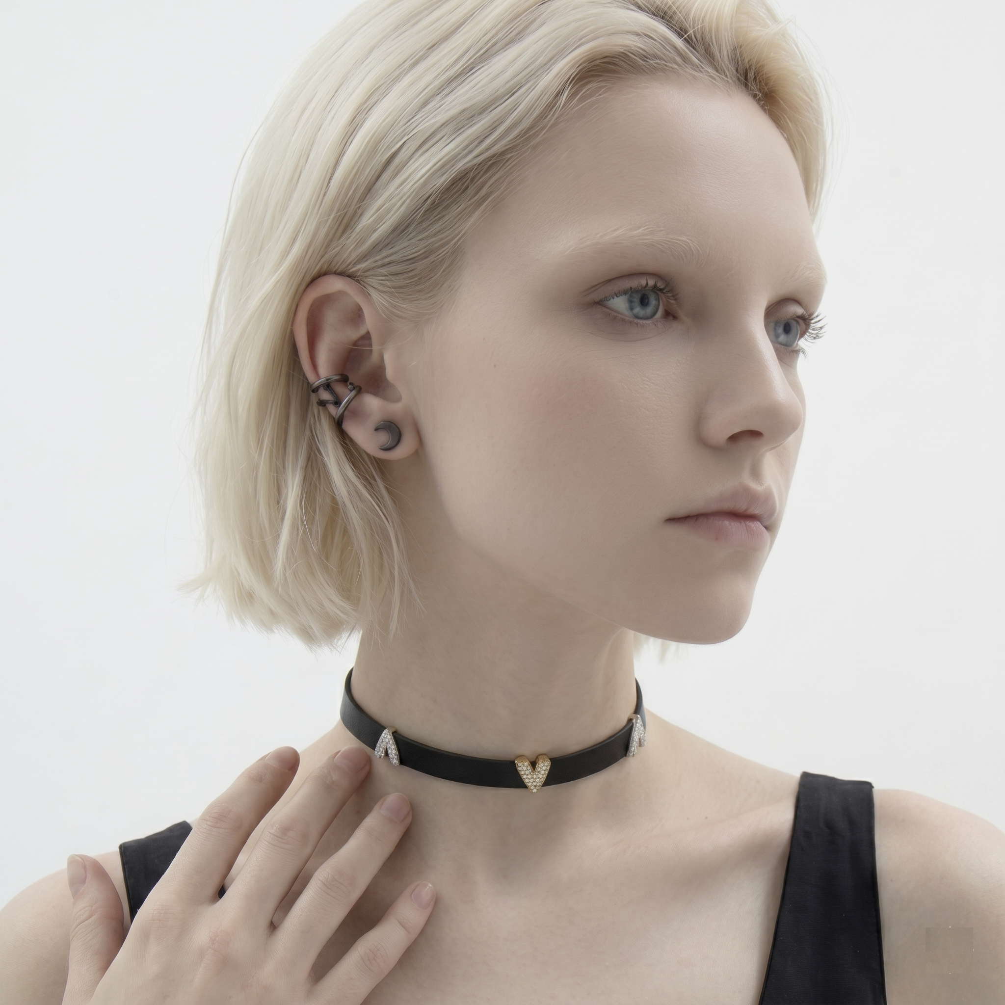 Woman wearing a black choker with heart pendants on a plain background