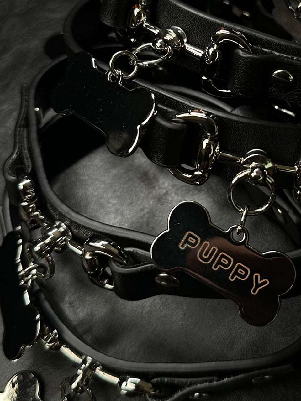 A collection of stylish bdsm poster collars, each featuring a secure lockable day collar design with unique locking sub collar features. These collars are perfect for those who appreciate submissive jewelry, combining functionality and fashion in one exquisite piece. Created with high-quality materials, each collar reflects a bold and powerful aesthetic from HushCrafts.