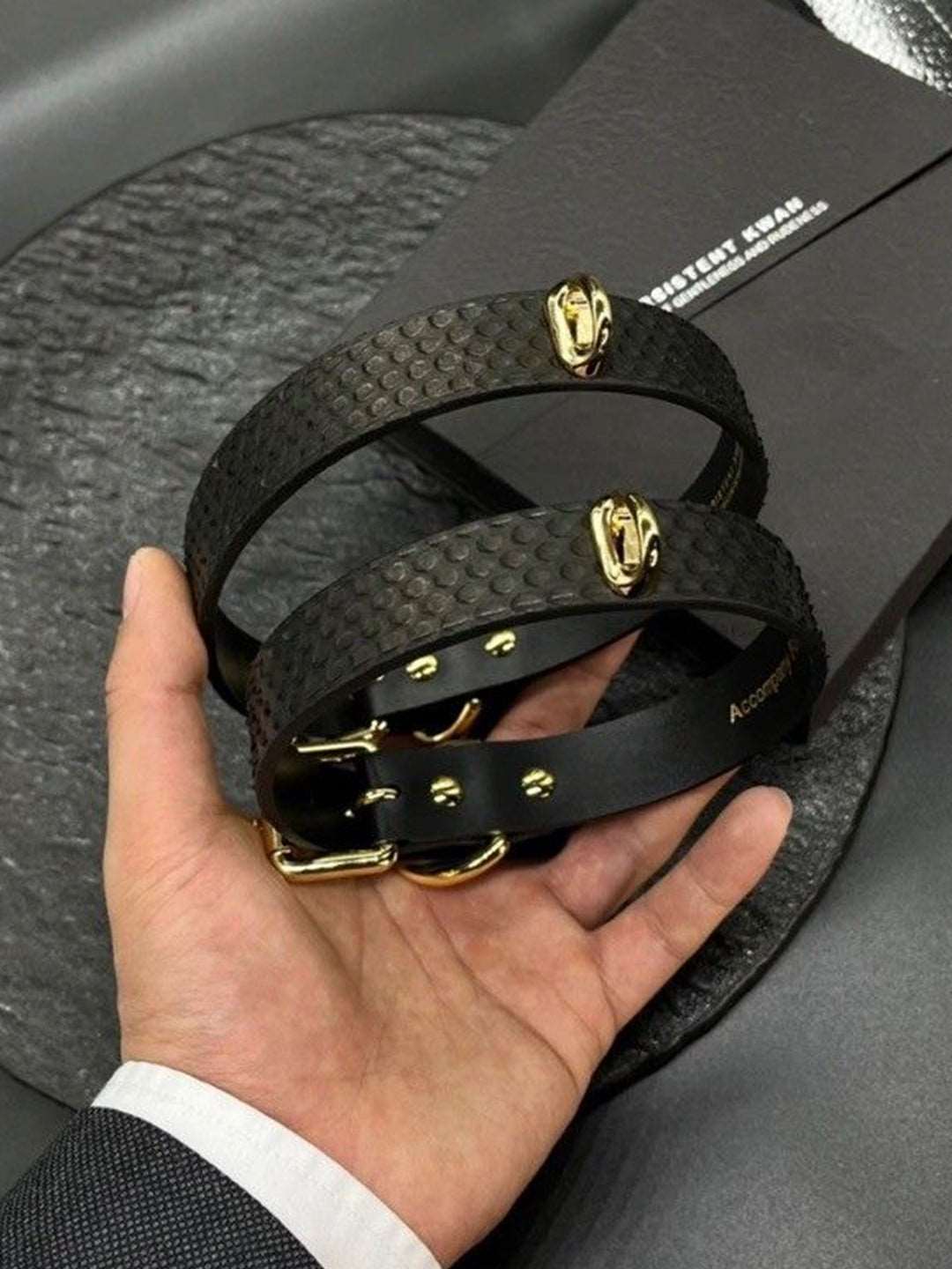 Handmade black leather collar necklace for women with unique snake-skin texture, gold hardware, and BDSM-inspired design. Crafted for a bold, edgy style, this accessory adds a touch of luxury to any outfit.