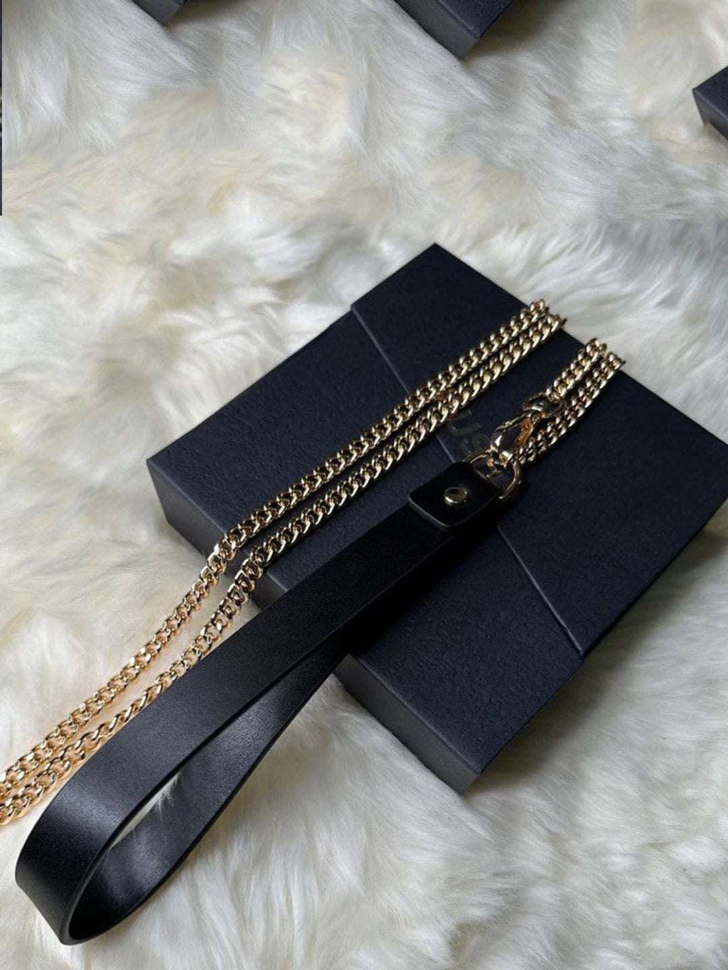 A stylish black leather collar featuring a chain design, perfect for adding a bold touch to any bdsm collar necklace collection. This accessory is designed for those looking to explore unique fashion statements and submissive collar styles by HushCrafts.