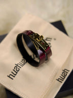 Burgundy leather collar necklace with locking collar design for women by HushCrafts. A stylish and bold accessory with gold hardware, perfect for alternative fashion and BDSM enthusiasts looking for a unique statement piece.