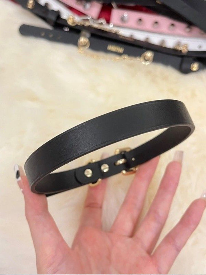 A sleek black leather collar, perfect for a discreet day collar look, featuring a locking necklace design, part of the BDSM leather collection by HushCrafts.