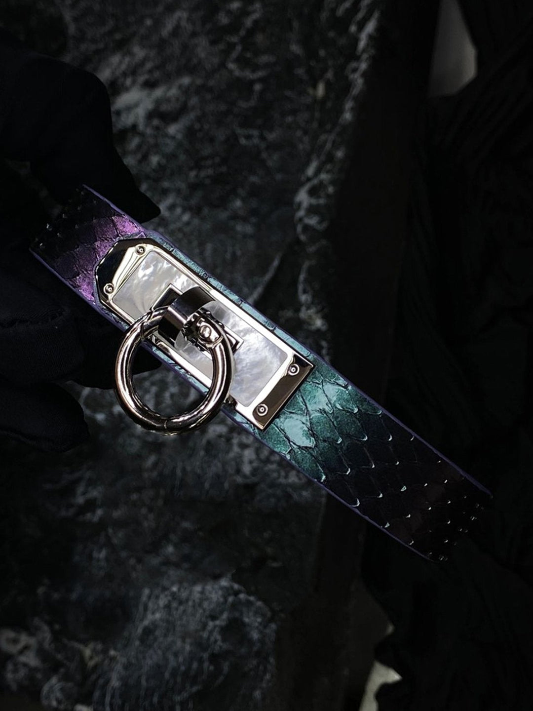 HushCrafts genuine snakeskin locking collar with an iridescent finish, featuring a secure O-ring and elegant clasp design.